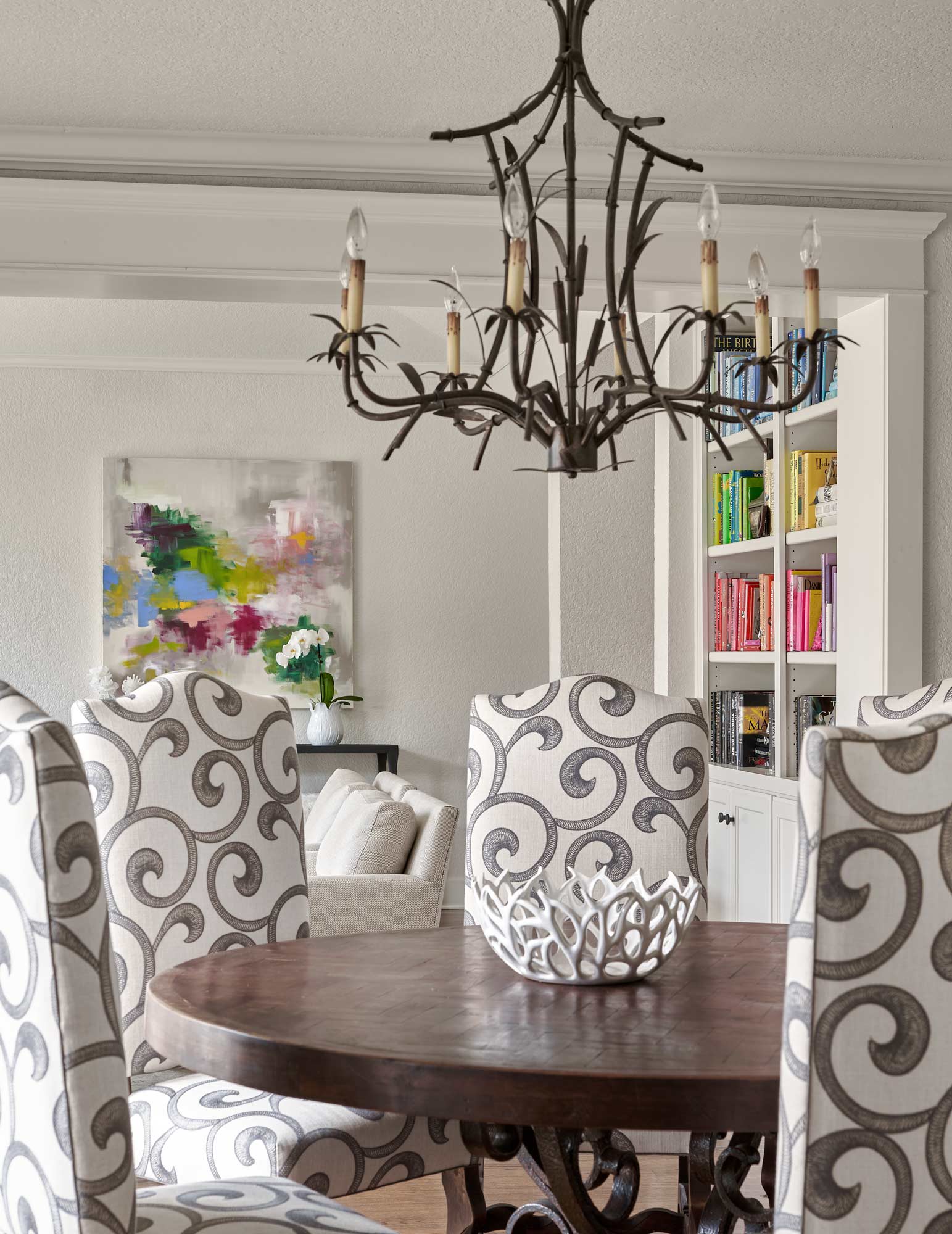 dining room table keller henderson interior design pops of color bookshelves